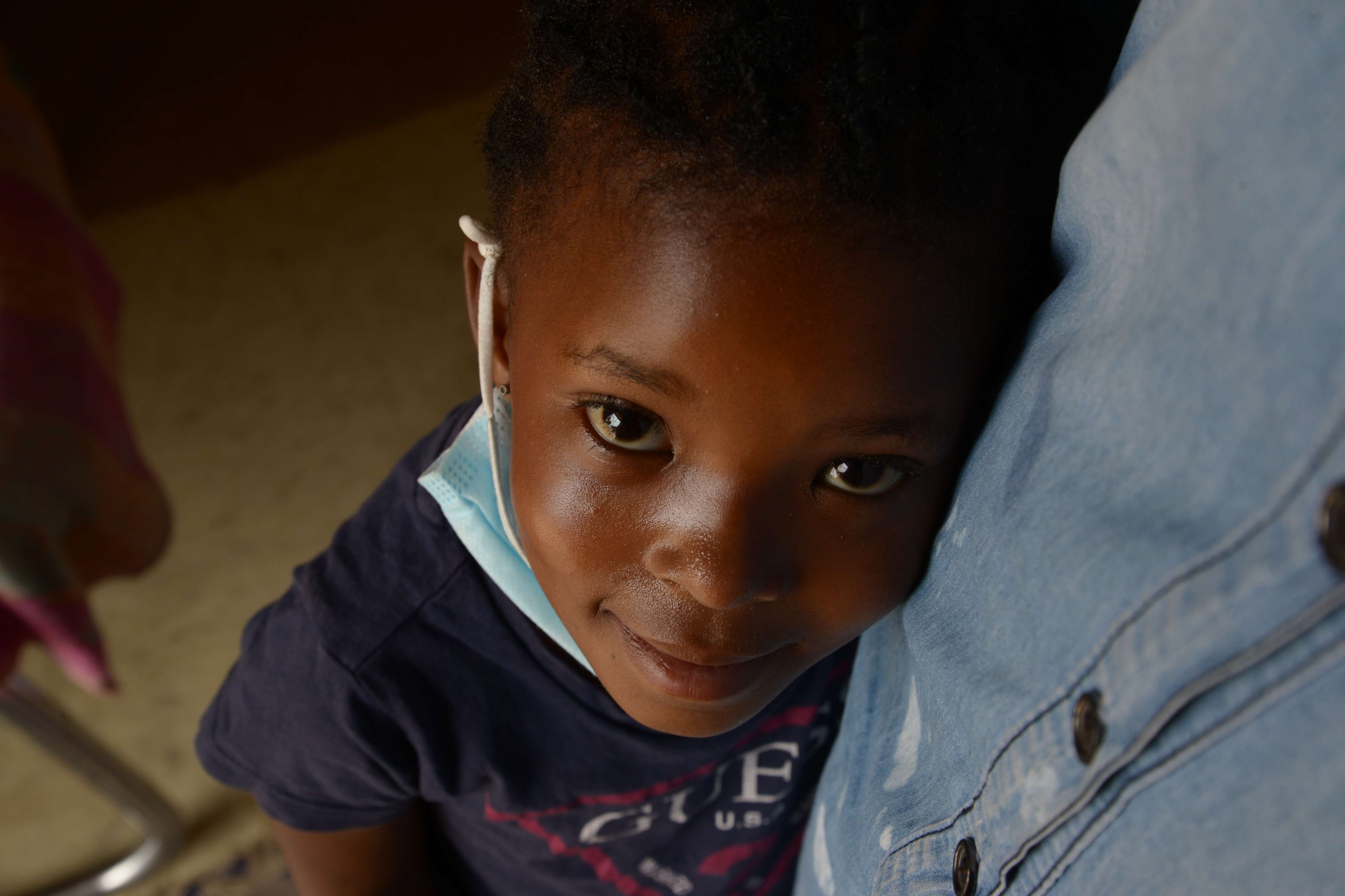 Smiling young child during a Bible outreach at a school in
          onclick=